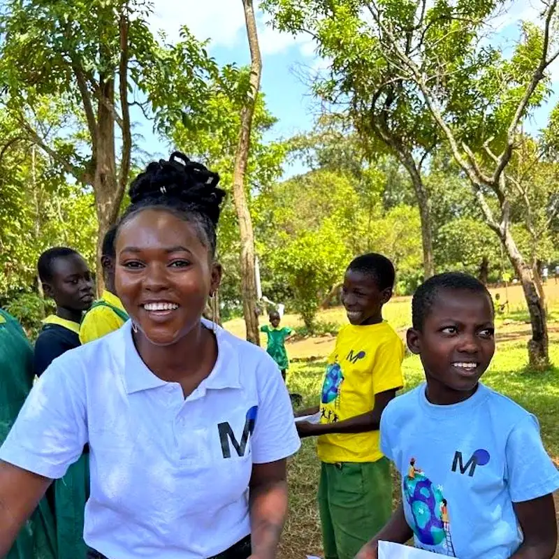 Young Earth Guardians with a MOTHERLAND team member at a school in Siaya County