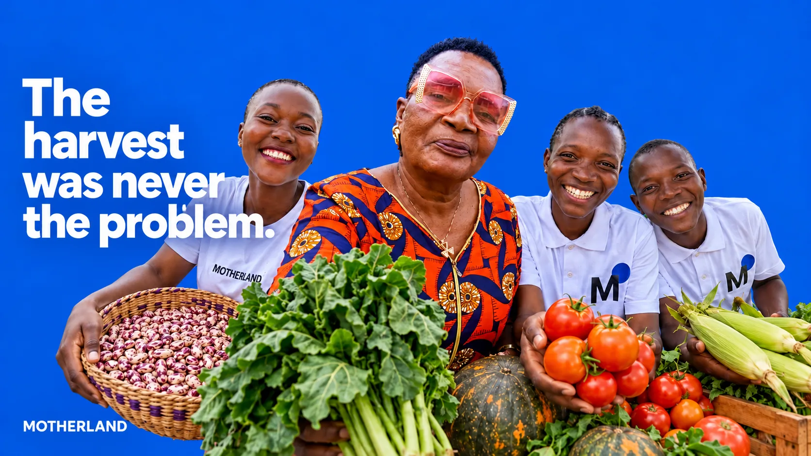 A farmer in pink glasses and three young people in MOTHERLAND shirts laughing against a blue background, holding beans, sukuma, pumpkins, tomatoes and maize