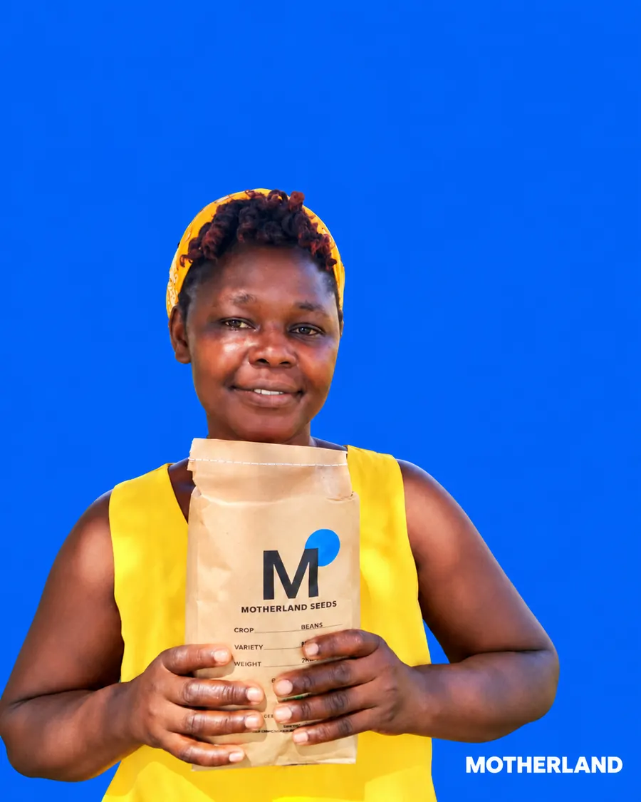 Farmer from Siaya County holding a bag of MOTHERLAND SEEDS